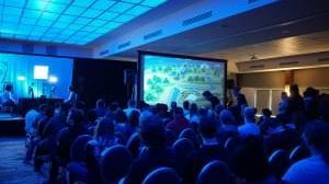 Photo of People in theatre watching presentation